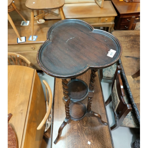 629 - A 1920's dark oak 3 tier plant stand with cloverleaf top, on barley twist supports