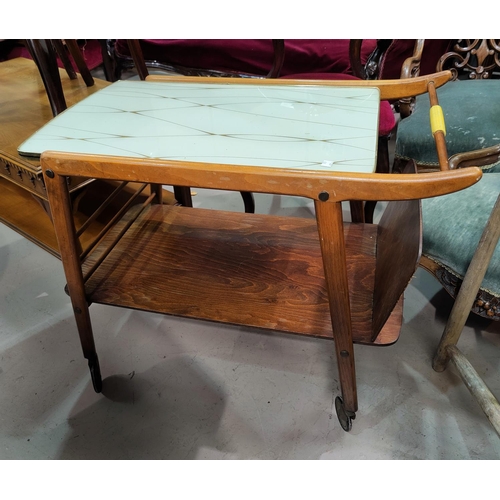 660 - A 1920's G-Plan coffee table bearing label and a mid century tea trolley