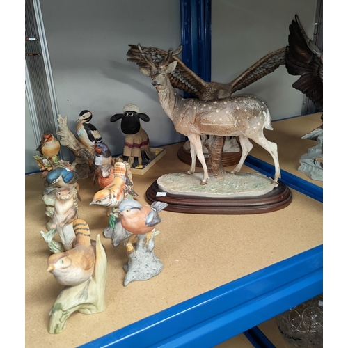 13 - A resin deer and eagle; a selection of bisque animals and birds