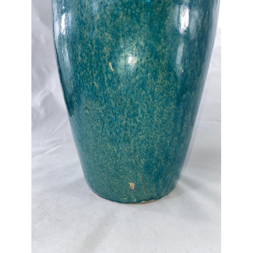 136A - An oriental turquoise glaze baluster vase, height 42cm, damage to base