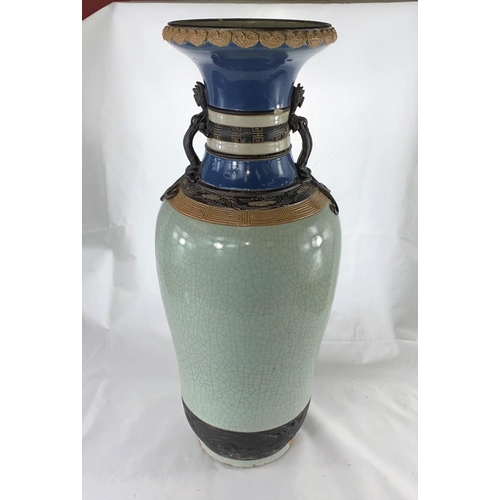 184 - A large Chinese crackle glaze vase with dragon mounts to the sides, seal mark to base, top broken an... 