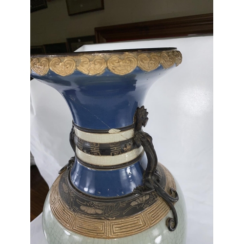 184 - A large Chinese crackle glaze vase with dragon mounts to the sides, seal mark to base, top broken an... 