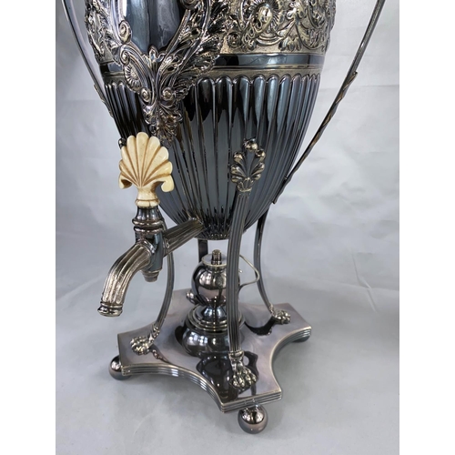 355 - A silver plated tea urn in the embossed classical style