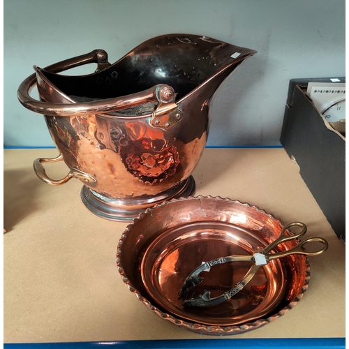 80 - A 19th century copper coal helmet; copper dishes; etc.