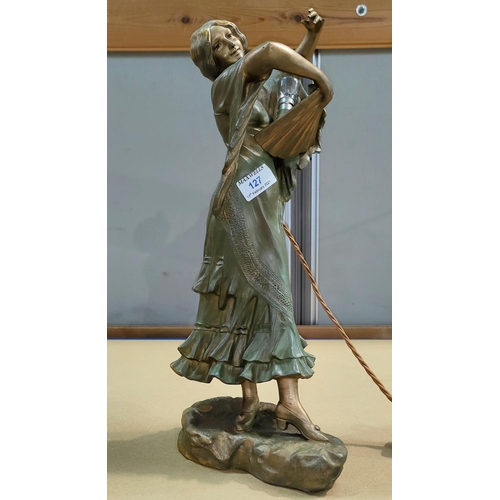 127 - A French Spelter lamp in the form of a woman with fan in green and gilt (signed to base)