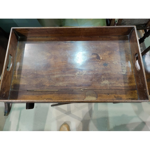 522 - A 19th century mahogany Butler's Tray on folding stand