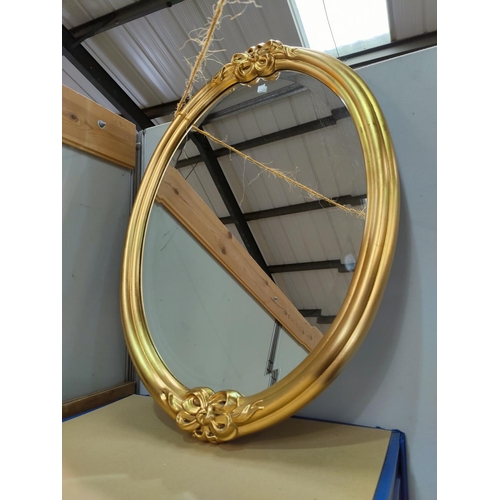 96a - A bevelled edge wall mirror in oval gilt frame; a cobblers cast iron shoe last, size 3/4