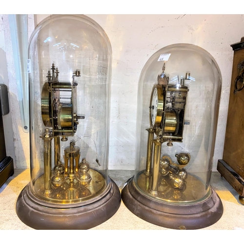 464 - Two early 20th century brass 400 day clocks under brass domes