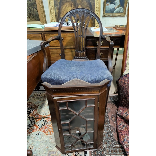 513 - A mahogany armchair in the Hepplewhite style with arch back and wheatsheaf splat, seat with blue uph... 