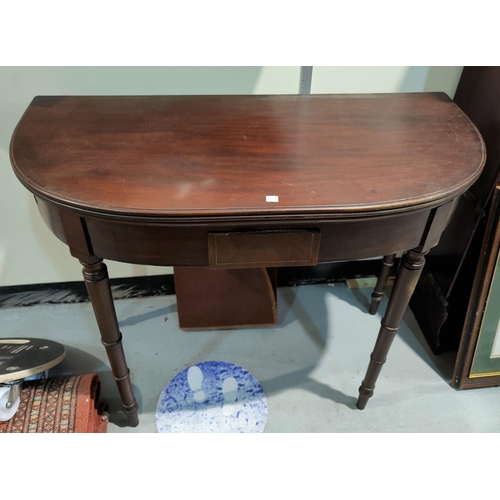 668 - A late Georgian tea table with fold-over 'D' end top, on turned tapering ringed legs, width 93 cm