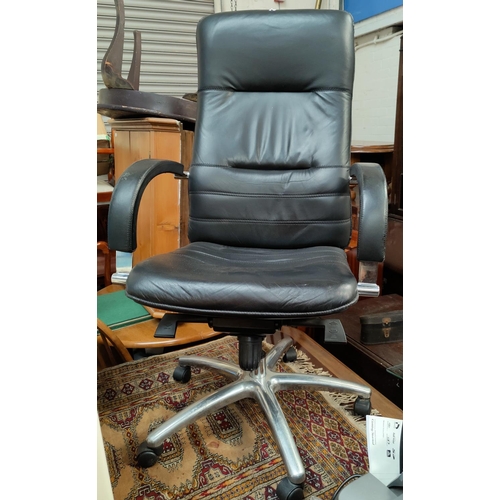 656 - A vintage black leather effect and chrome high back executive chair