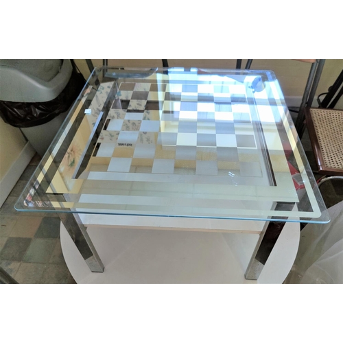 657 - A mirrored effect chess top coffee table and two folding chairs