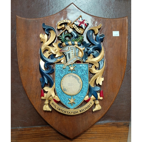 437A - A coat of arms of Captain Cook on shield shaped wall plaque 'circa orbem' to the crest, 'Nil Intenta... 