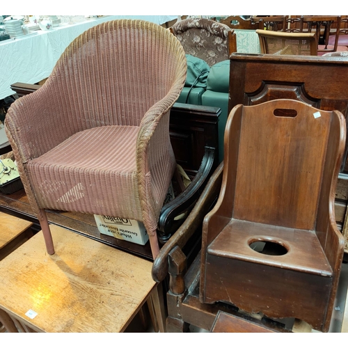 659 - A Victorian child's rocking chair; a Lloyd Loom chair in pink and a matching linen basket