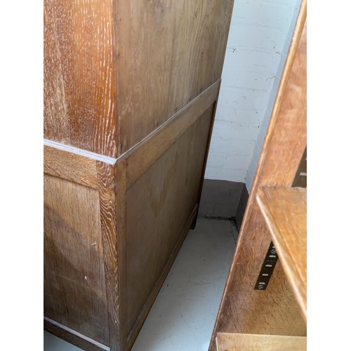 500 - A 1930's limed oak 4 height chest of drawers with bookcase top, by Heals, height 158cm x length 76cm... 