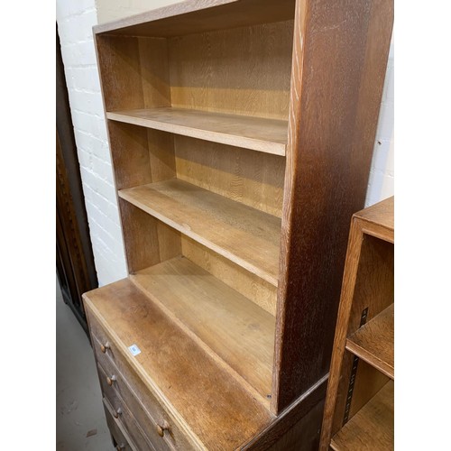 500 - A 1930's limed oak 4 height chest of drawers with bookcase top, by Heals, height 158cm x length 76cm... 