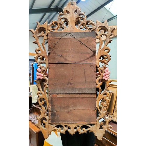 547 - A 19th century rectangular bevelled edge wall mirror in carved and gilded Florentine style frame, he... 