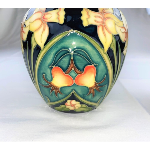 14 - A Moorcroft Carousel pattern ginger jar decorated with daffodils, rosehips & primroses height impres... 