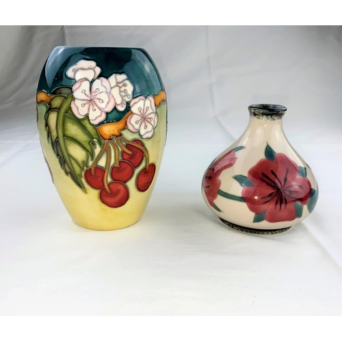 18 - A Moorcroft vase of ovoid form decorated with cherries & white flowers, designed by D.J. Hancock,  i... 