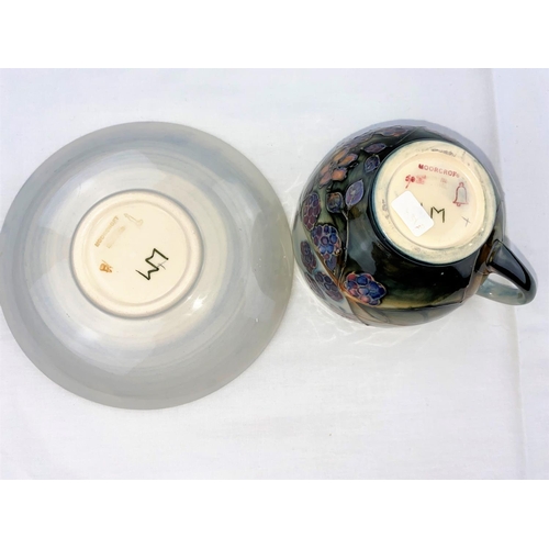19 - A Moorcroft cup & saucer decorated with brambles (blackberries & leaves) impressed & monogrammed (se... 