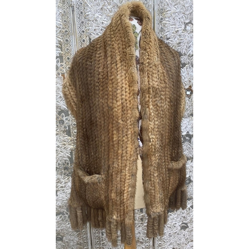 232 - A long soft honey coloured fur scarf / wrap with pockets and tasselled ends