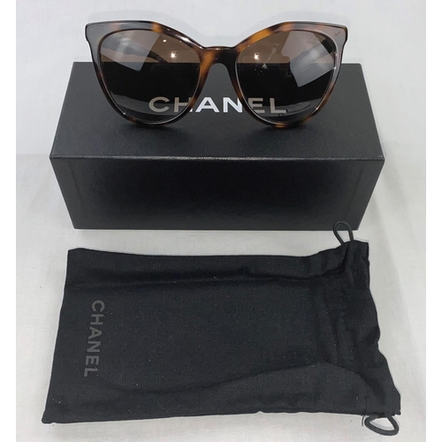 239 - A pair of Chanel lady's sunglasses with loose beaded arms, with box and cloth cover (some scratching... 