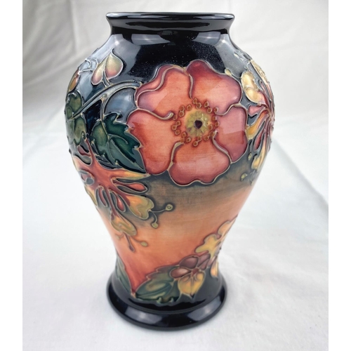 24 - A Moorcroft inverted baluster vase decorated in the Honeysuckle & Dog Rose pattern  impressed & mono... 
