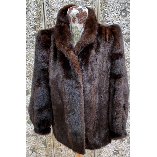 246 - A c1970's brown mink jacket with tight cuffs, stand up collar, size 14, by Barry Whitby; a mink stol... 