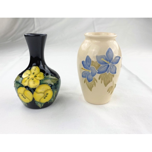 28 - A small bulbous slender neck Moorcroft vase decorated with primroses, impressed & monogrammed height... 