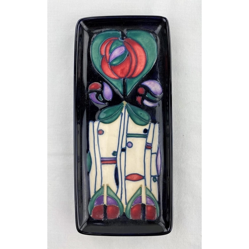 41 - A red Moorcroft pen tray decorated in the Secessionist manner impressed & monogrammed length 20.5cm ... 