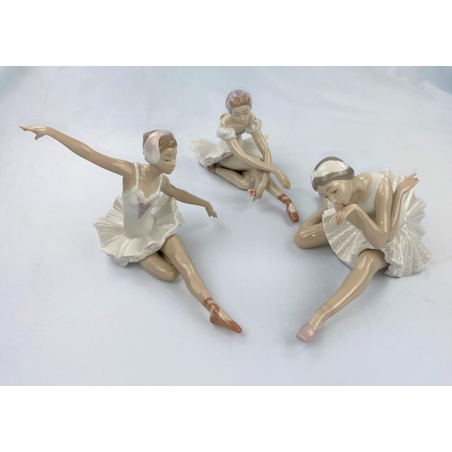 47 - Three Nao figures of girl ballerinas doing floor exercises