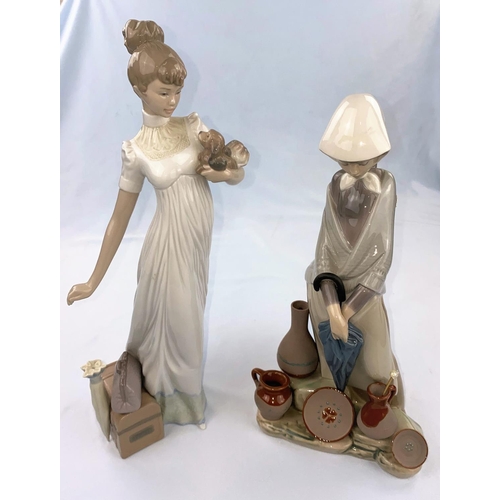 50 - A large Lladro figure: girl with puppy and parasol, height 35cm; a large Lladro figure : girl with u... 