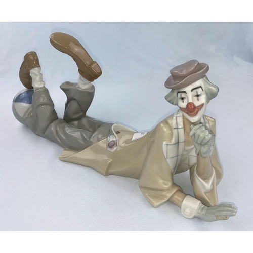 56 - A Lladro figure reclining clown with ball