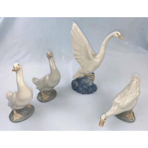 58 - A Nao figure goose with outstretched wings, 3 Nao ducks