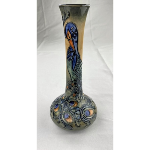 9 - A Moorcroft vase with squat body & tall slender neck decorated with a peacock impressed & monogramme... 