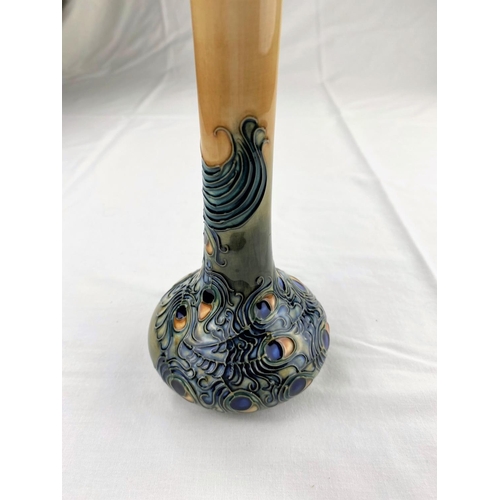 9 - A Moorcroft vase with squat body & tall slender neck decorated with a peacock impressed & monogramme... 