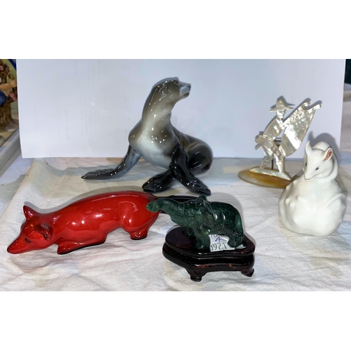 97 - A Rosenthal Seal; a Royal Copenhagen mouse, a Royal Doulton flambe fox; a jade coloured elephant & a... 