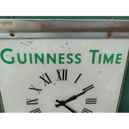 123 - A Guinness swinging clock/advertising poster height 54cm