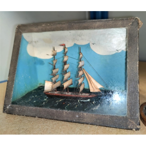 124 - A miniature model 3 masted ship in glass case, Length 9cm & a similar under glass dome