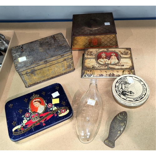 149 - A Savory & Moore's glass valveless feeder bottle, a collection of vintage tins including small fish ... 