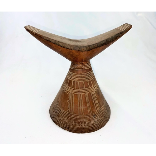 162 - An East African tribal neck rest, Gurage, with conical base having incised geometric decoration 17cm... 