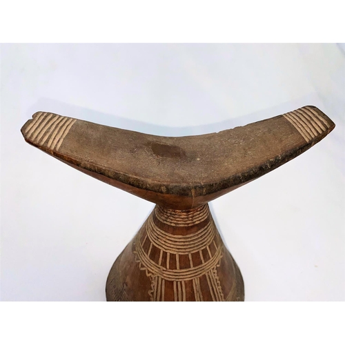 162 - An East African tribal neck rest, Gurage, with conical base having incised geometric decoration 17cm... 