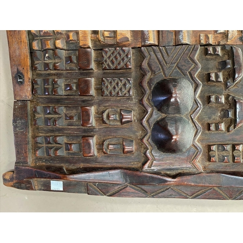 161 - A West African tribal grainstore door, carved figures, sliding catch, 37 x 34cm
