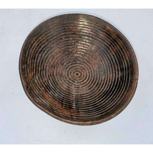 163 - An African tribal rootwood bowl, concentric engraved line decoration, 3 metal stud feet 19 x 18cm