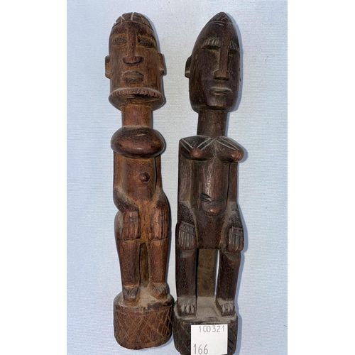 166 - A pair of African tribal carved wood figures, male and female 19cm
