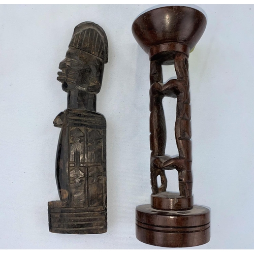 168 - An African tribal carved wood figure 22cm; a hardwood candle holder 20cm