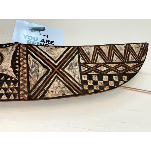 184 - An East African tribal carved wood hawk mask, Bwa shallow carved geometric decoration painted in ear... 