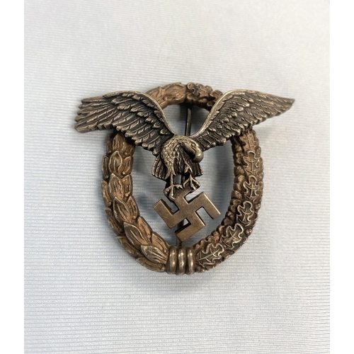 351A - A German World War II Luftwaffe pilots badge with eagle in wreath stamped OM to back of eagle 5cm (r... 