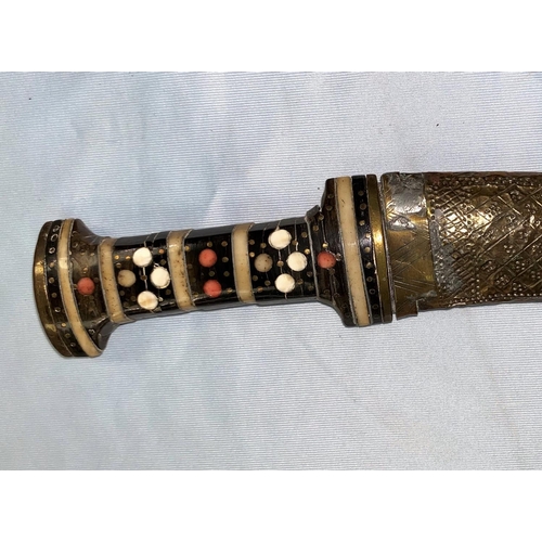 368 - A vintage Middle Eastern dagger with inlaid hilt, embossed brass scabbard & Arabic script to the bla... 