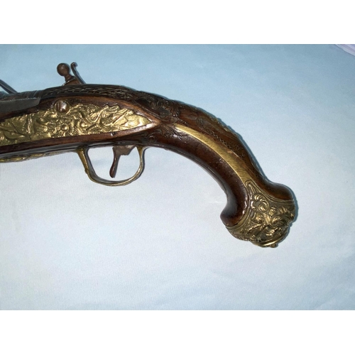 372 - A late 18th century/early 19th century Ottoman blunderbuss pistol with extensive chased relief decor... 